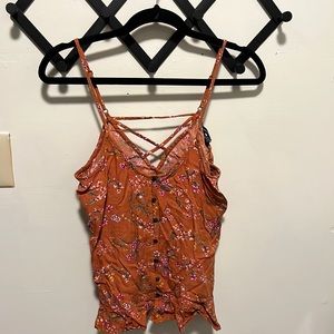 American Eagle rust and floral tank top with criss-cross back and ruffle edge